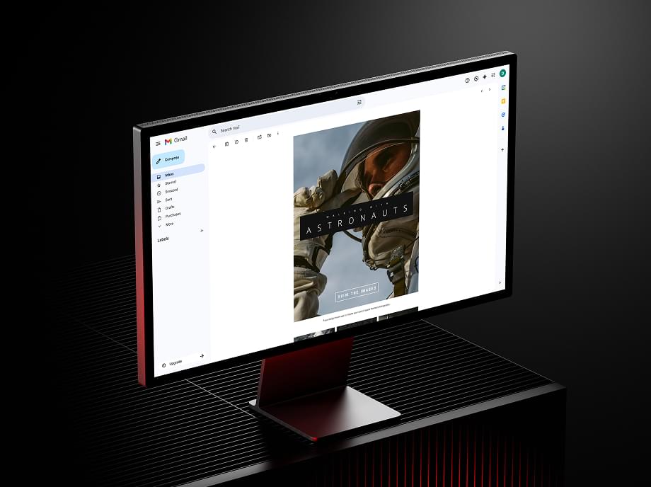 Astronaut-themed HTML email template open in Gmail on a desktop monitor